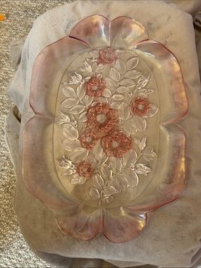 A pink-tinted Mikasa Rosella glass serving tray with embossed roses.